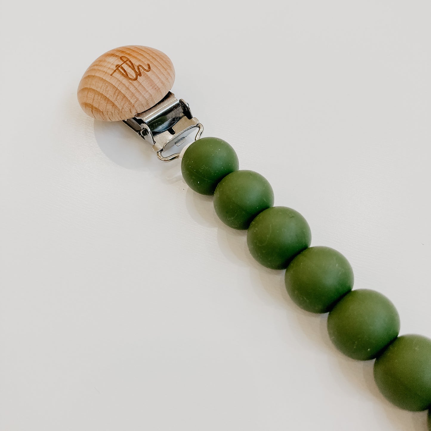 jolie pacifier clip in army green close up