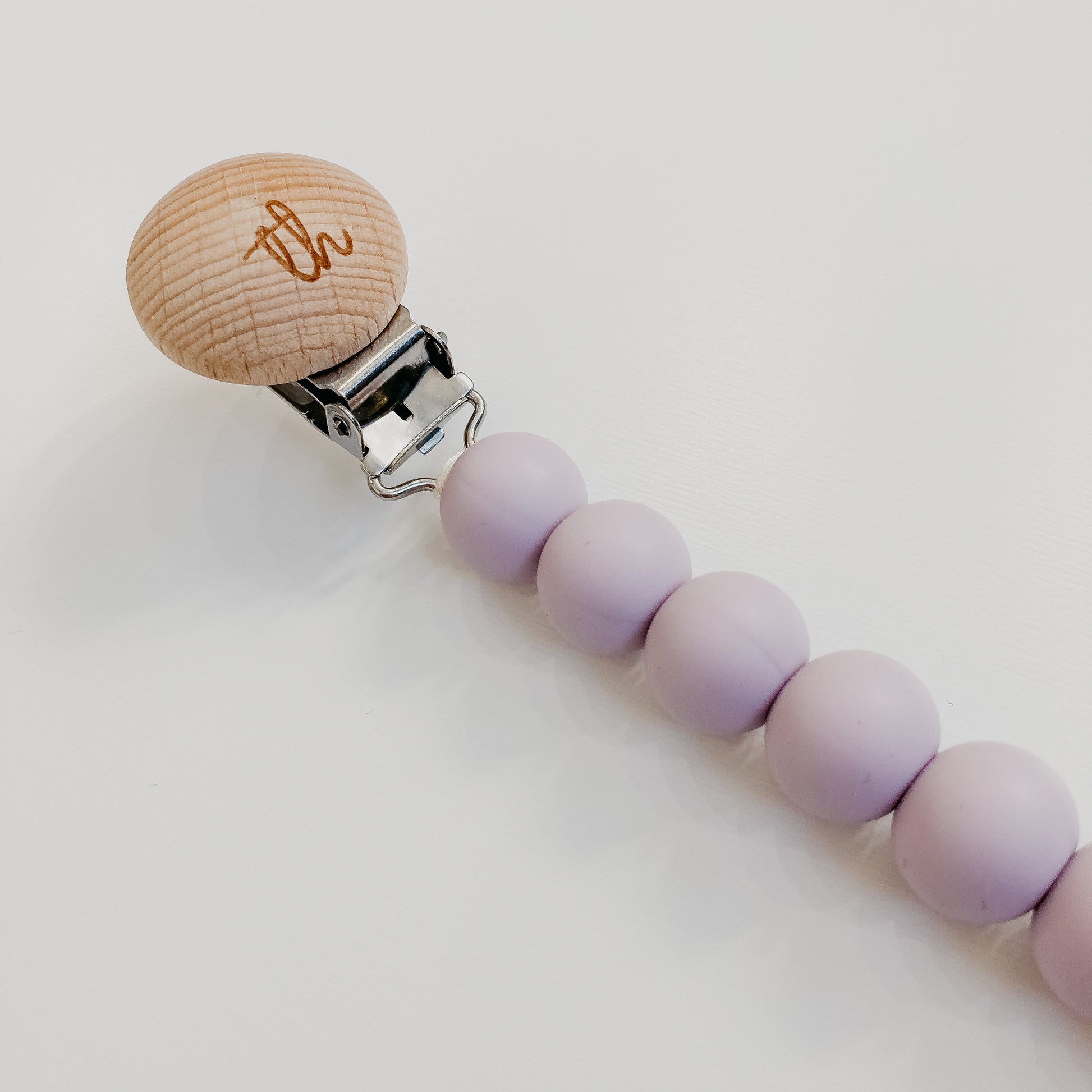 the jolie pacifier clip in lavender fog close up